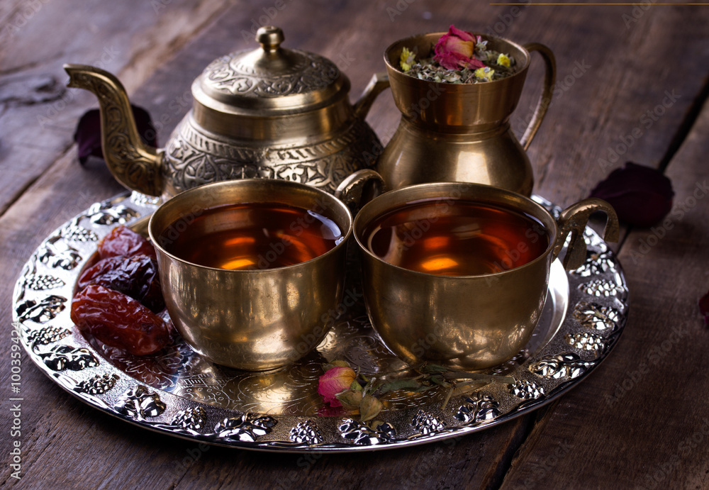 Traditional arabic tea set and dried dates. Traditional arabic tea set and dried dates.