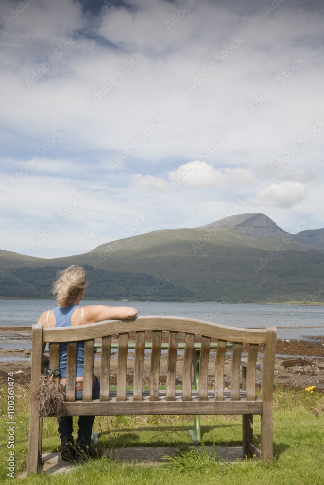 Woman looking towards Mountains, Isle of Mull, Scotland, UK