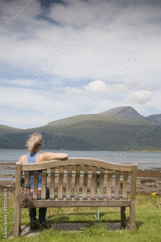 Woman looking towards Mountains, Isle of Mull, Scotland, UK