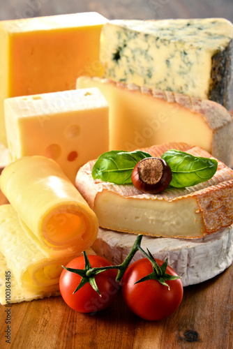 Different sorts of cheese on kitchen table