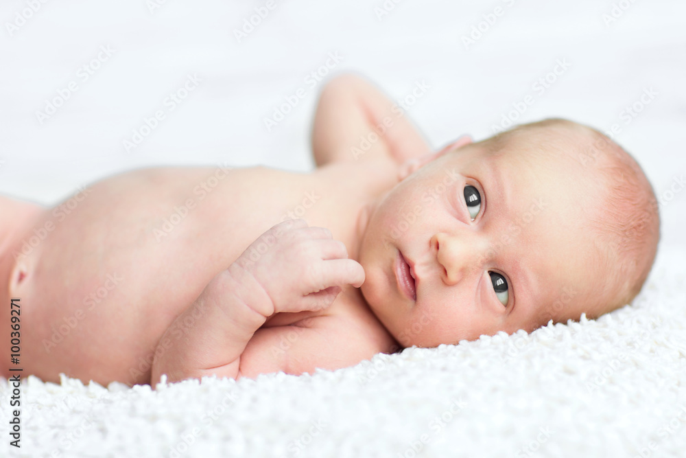 adorable newborn boy sleeps on the white blanket with background adorable newborn boy sleeps on the white blanket with background