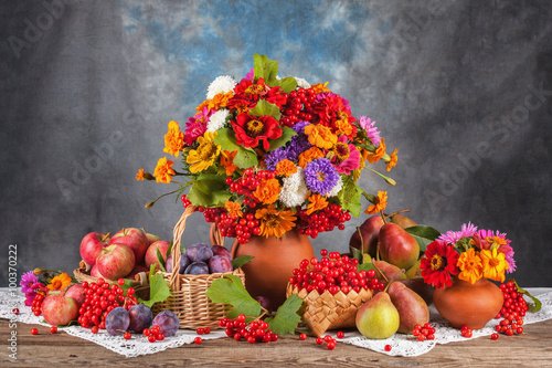 Autumn bouquet and fruit on the table