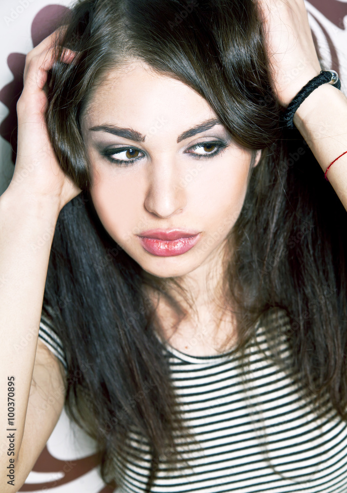 Fototapeta premium Portrait of a beautiful young woman in black and white with piercing eyes