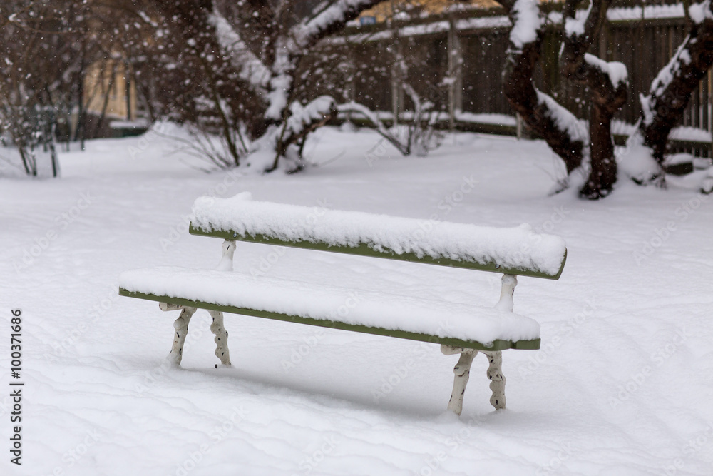 bench with ice on snowy winter day, lake chiemsee bench with ice on snowy winter day, lake chiemsee