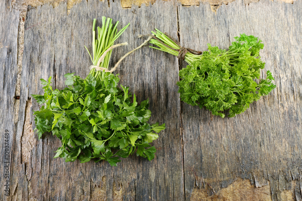 Fresh parsley on wooden background Fresh parsley on wooden background