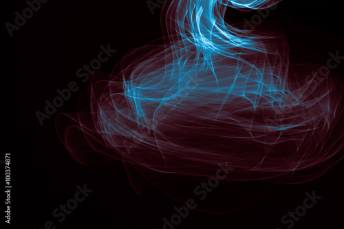 Glowing abstract curved blue and red lines