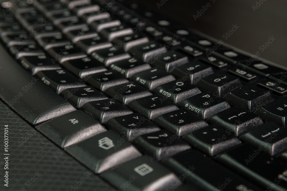 Keyboard with letters in Hebrew and English - Wireless keyboard - Close up Keyboard with letters in Hebrew and English - Wireless keyboard - Close up