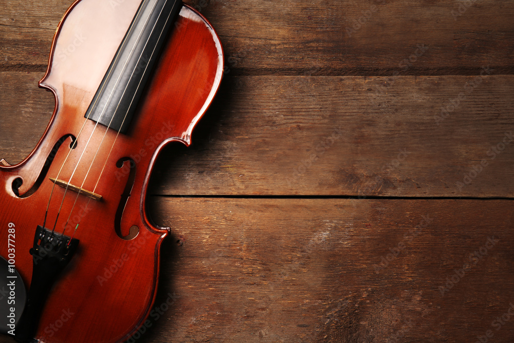 Fototapeta premium Violin on wooden background