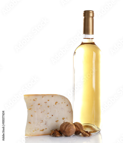 Cheese with walnuts and wine on light background