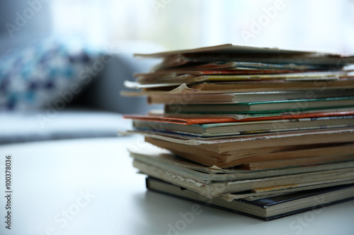 Pile of old books on white table © Africa Studio
