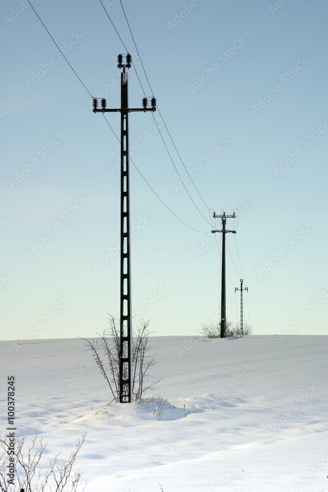 Electricity poles in the snow in Hungary Electricity poles in the snow in Hungary