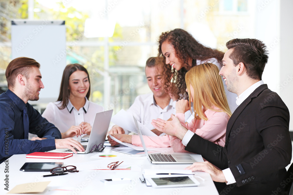 Young business people discussing a new project in a conference room Young business people discussing a new project in a conference room
