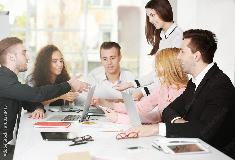 Young business people discussing a new project in a conference room Young business people discussing a new project in a conference room