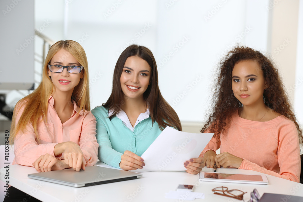 Young business people discussing a new project at the meeting in a conference room Young business people discussing a new project at the meeting in a conference room