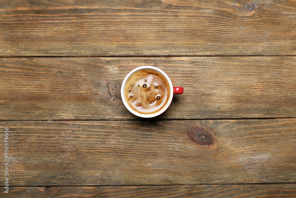 Cup of coffee on wooden table, top view Cup of coffee on wooden table, top view