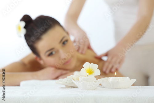 One do relaxing massage to pretty woman, close up