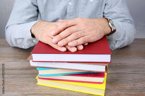 Man working with books, close up