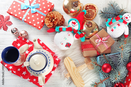 Fototapeta Naklejka Na Ścianę i Meble -  Christmas background. Decorations, cones, gift boxes on white wooden background