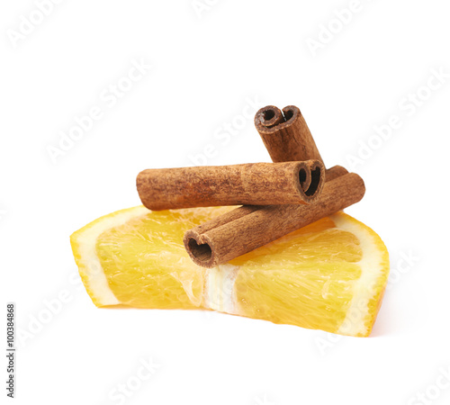 Orange slice and cinnamon isolated photo