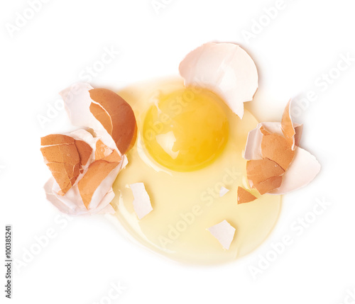 Cracked raw chicken egg isolated