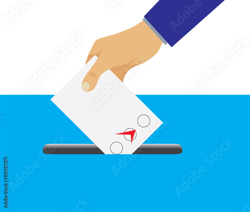 Hand putting voting paper in the ballot box.