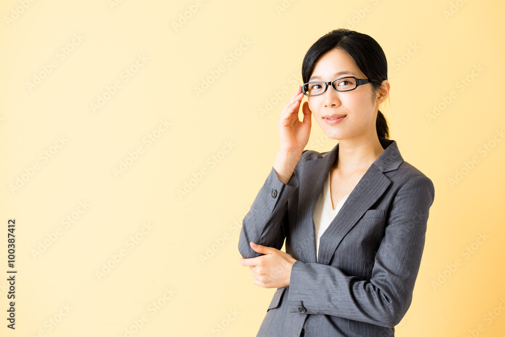 asian businesswoman isolated on yellow background asian businesswoman isolated on yellow background