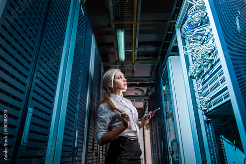 Young engineer businesswoman in network server room © agnormark