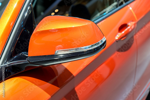 Close up of Orange Side Mirror Car © ake1150