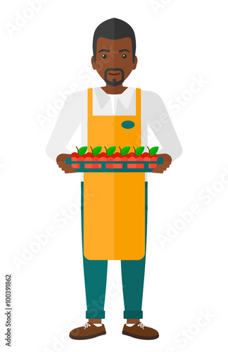 Smiling supermarket worker.