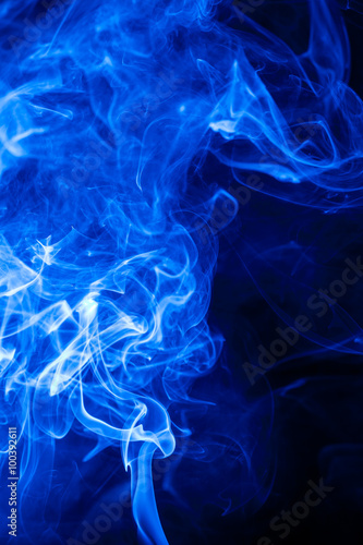 Movement blue smoke on black background.