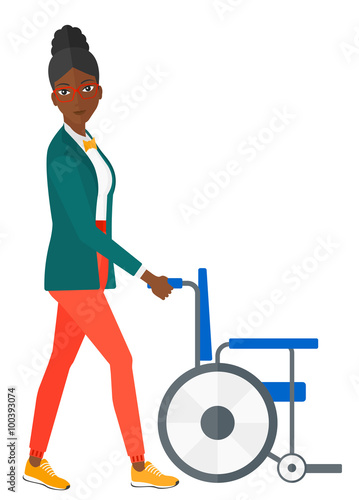 Woman pushing wheelchair.