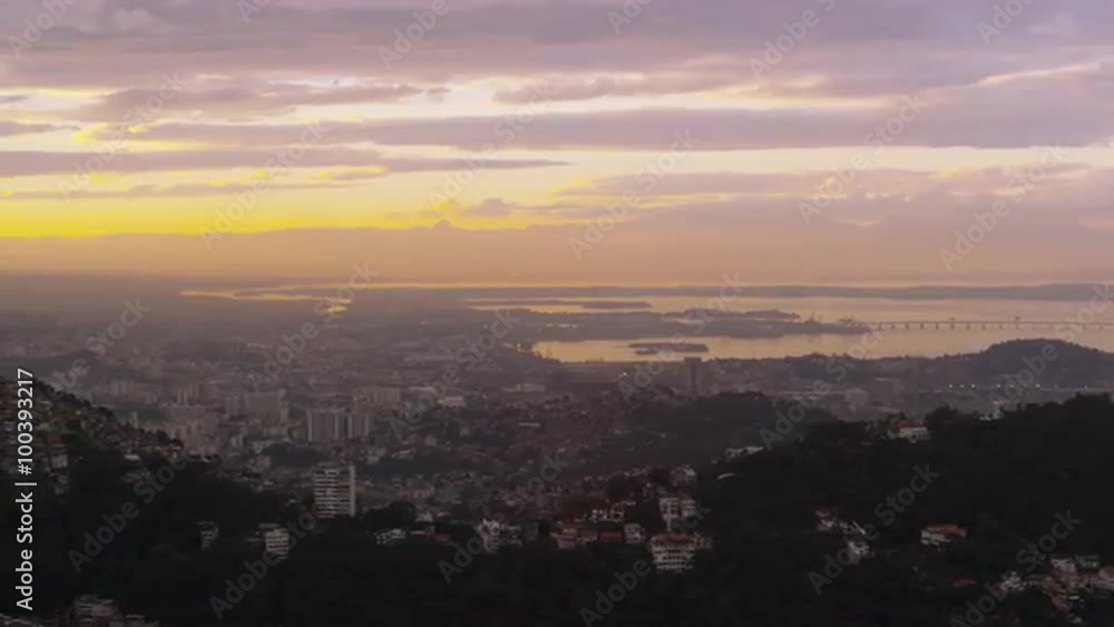 Pan over yellow and pink sunset above Rio de Janeiro cityscape. Pan over yellow and pink sunset above Rio de Janeiro cityscape.