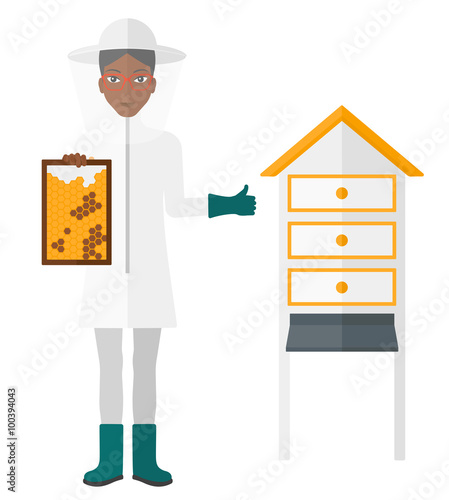 Bee-keeper at apiary.