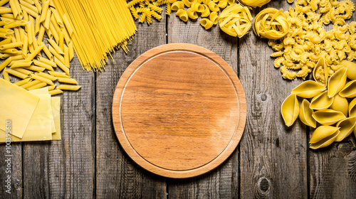 Mixed types of pasta and spaghetti with an empty plate.