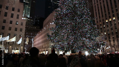 Huge Christmas tree decorated with lights and bulbs in New York.