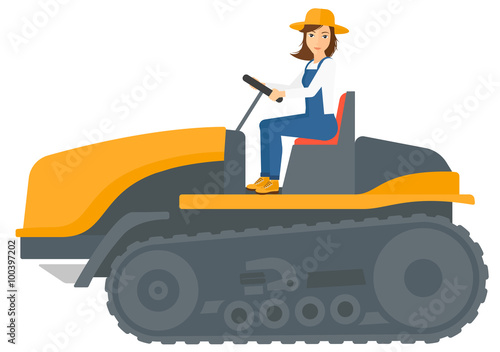 Farmer driving catepillar tractor.