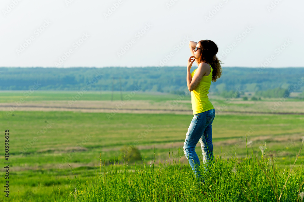 Woman looks into the distance outdoors Woman looks into the distance outdoors