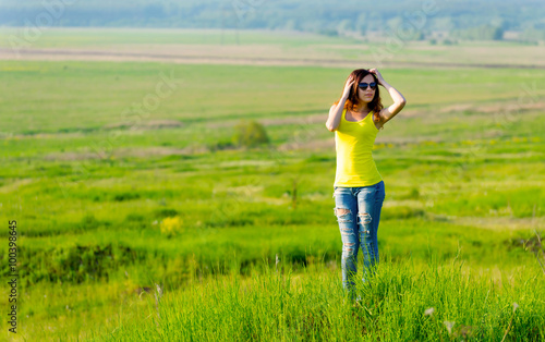 Woman looks into the distance outdoors