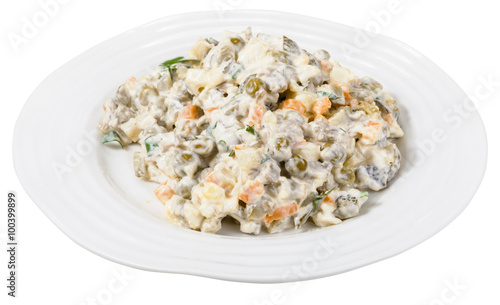 russian salad with mayonnaise on plate isolated