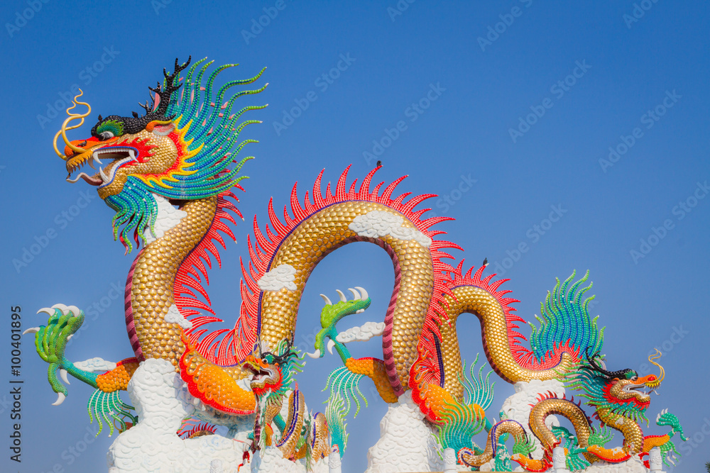Chinese dragon statue with two small birds on its back