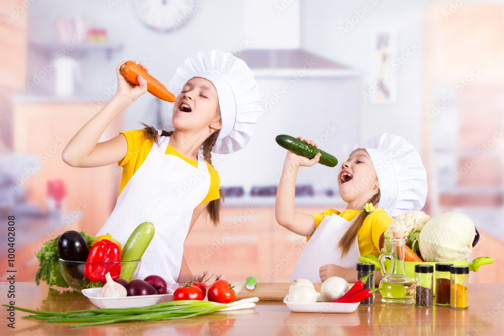 twin girl chef holding vegetables as a microphone and sing twin girl chef holding vegetables as a microphone and sing