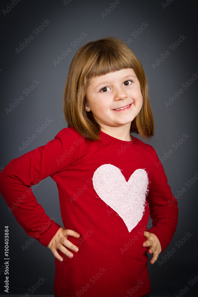 Beautiful smiling girl isolated over grey Beautiful smiling girl isolated over grey