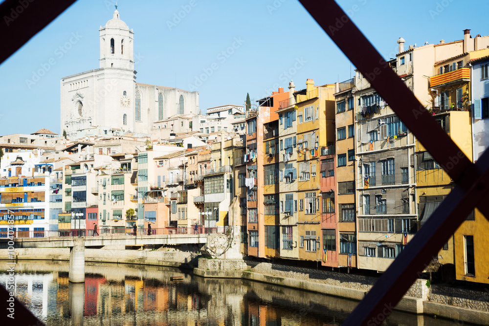 houses and church on river from Eiffel bridge  in Girona