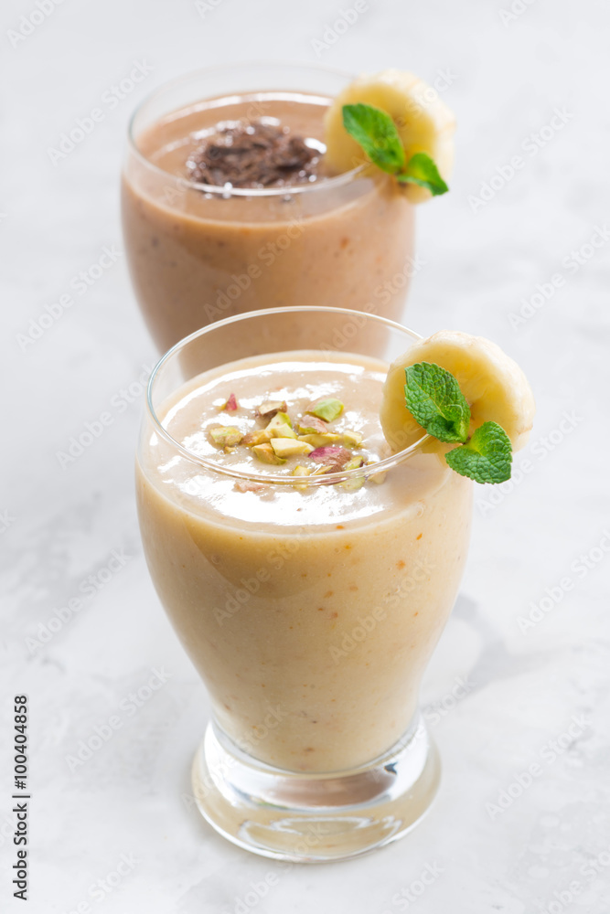banana and chocolate smoothie in a glasses, vertical banana and chocolate smoothie in a glasses, vertical