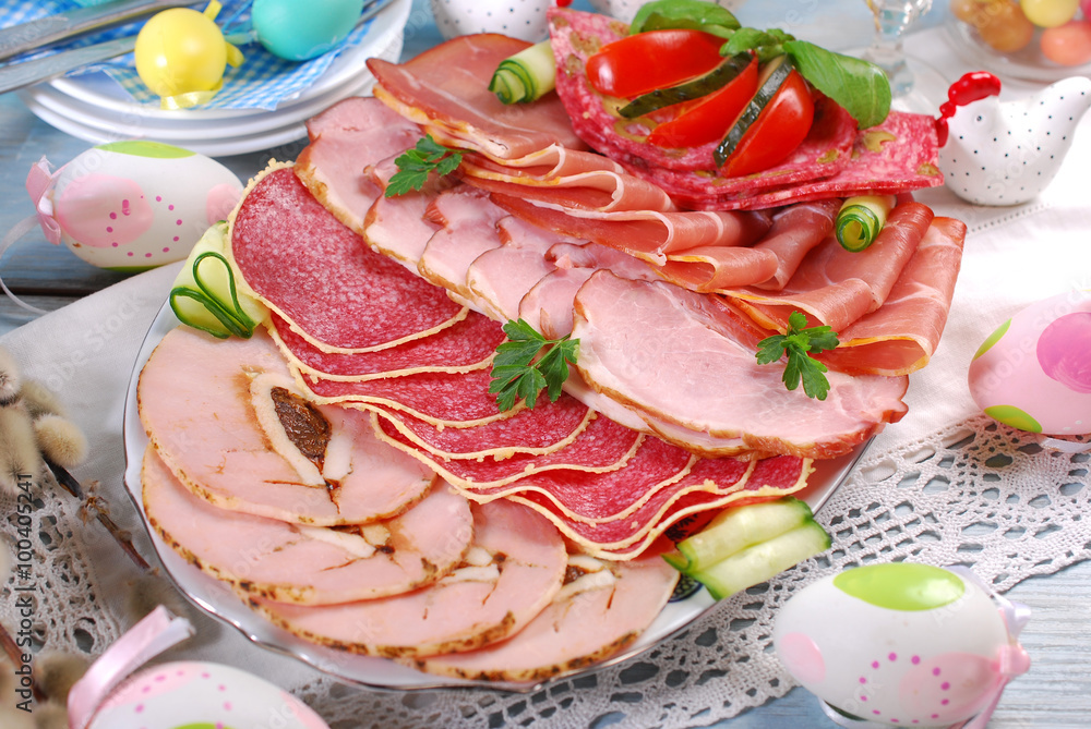 platter of cured meat,ham and salami on eater table platter of cured meat,ham and salami on eater table