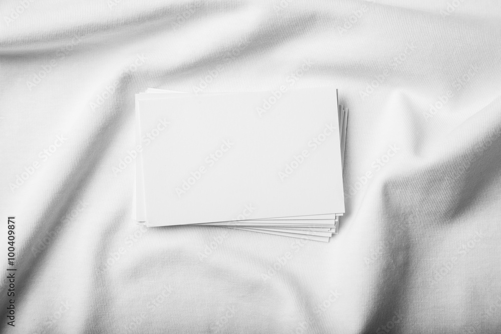 Closeup of set business cards on white tshirt Closeup of set business cards on white tshirt