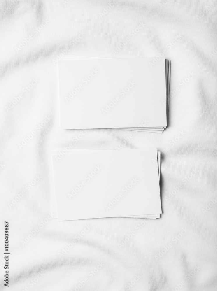Set of blank business cards on white tshirt. Set of blank business cards on white tshirt.