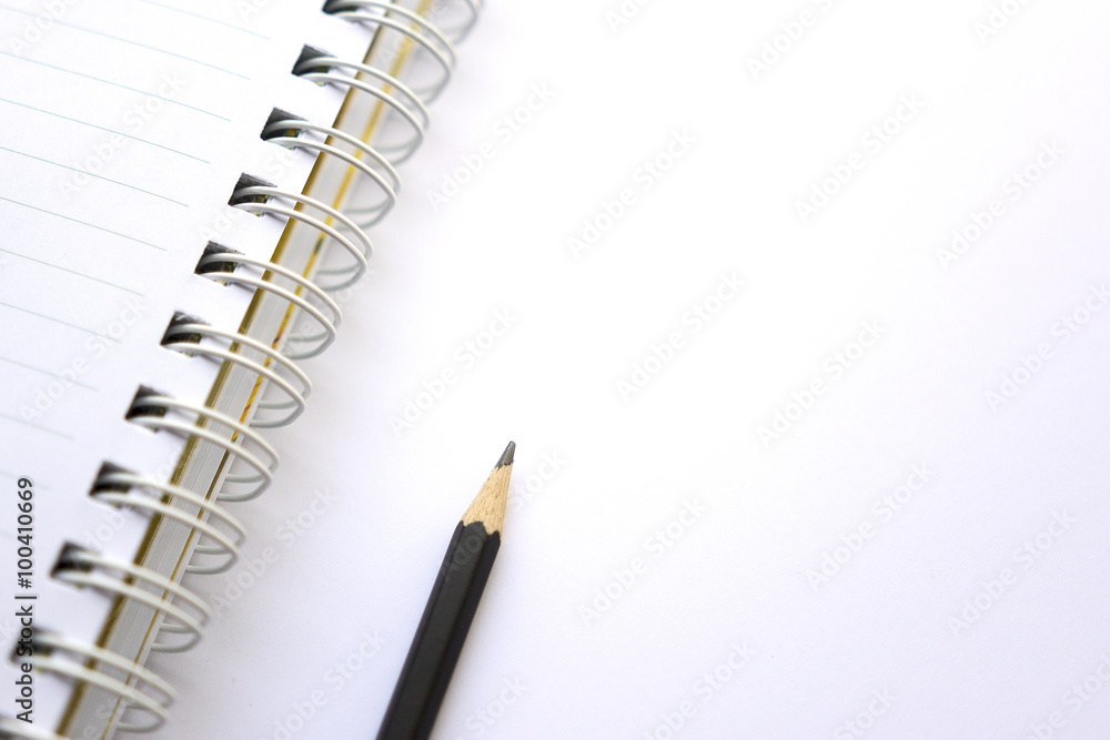 Pencil and notebook on white background Pencil and notebook on white background