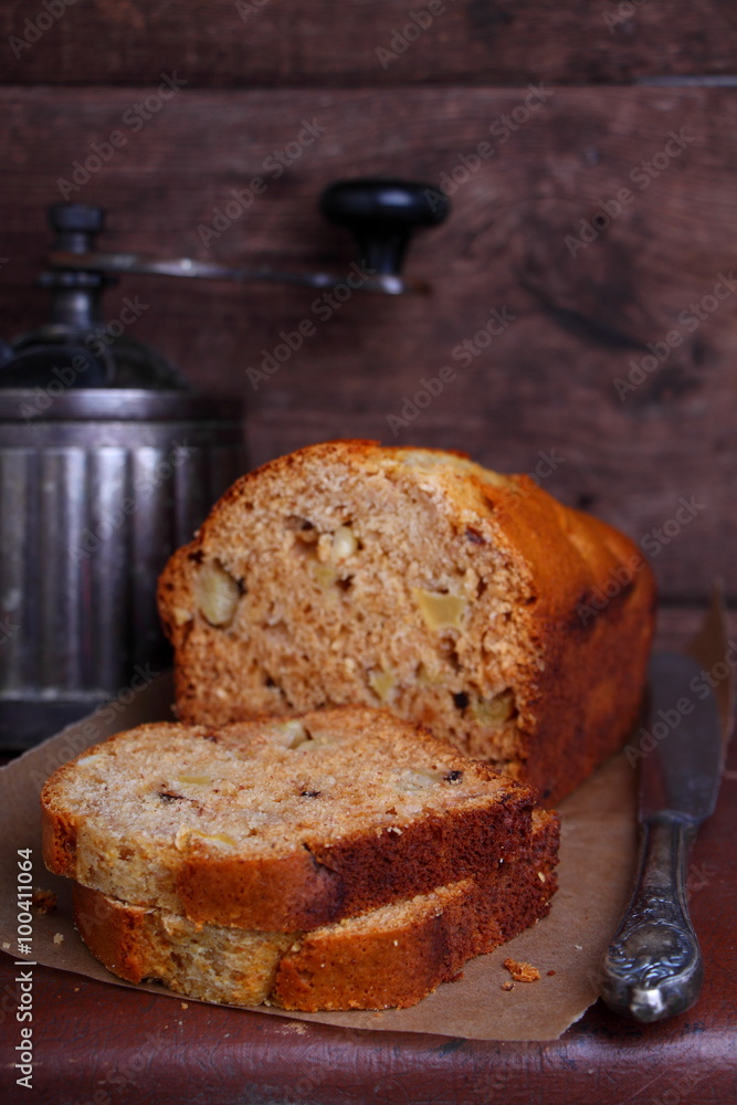 Apple cake with walnuts on a brown background Apple cake with walnuts on a brown background