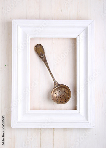 vintage cutlery (spoon ) in the white framed